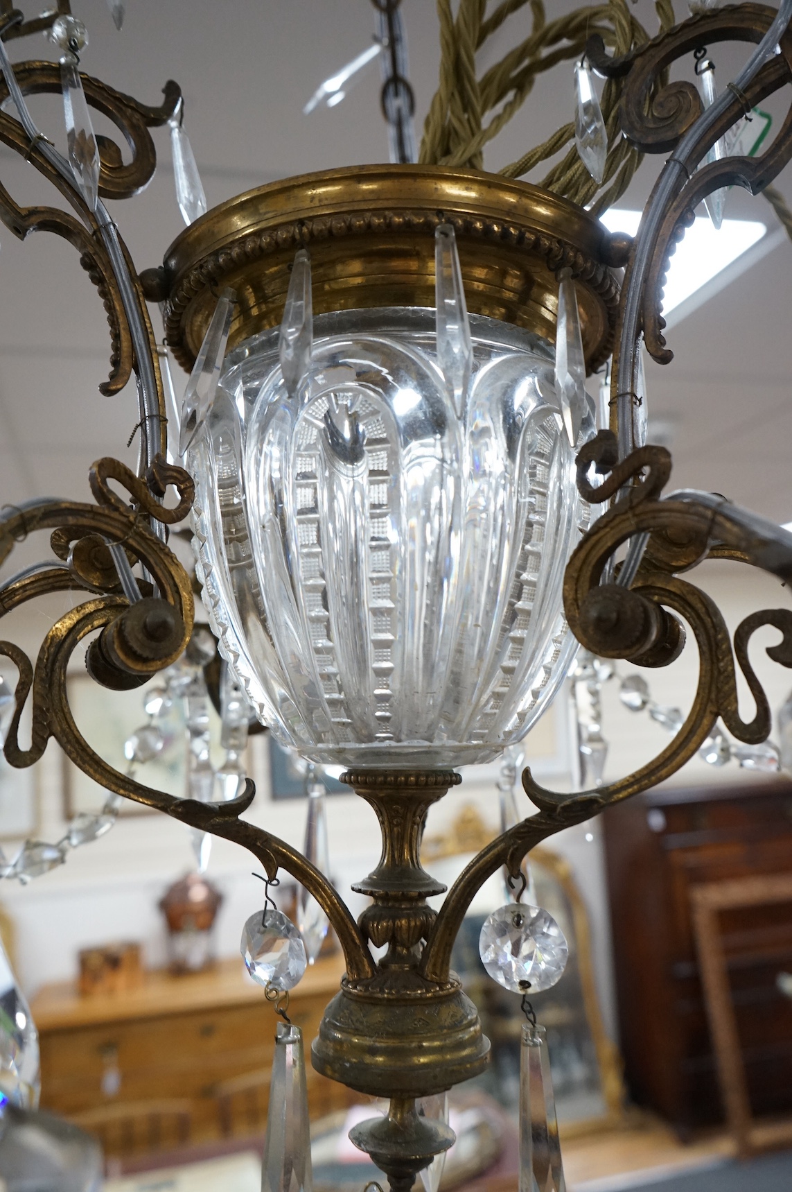 A glass and brass six branch chandelier, 65cm high. Condition - fair